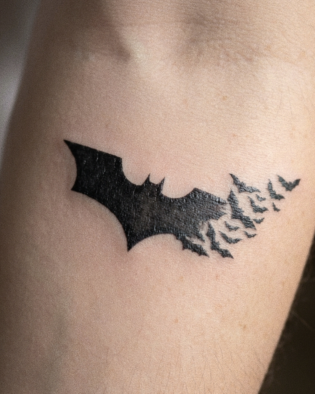 batman tattoo displayed on hand